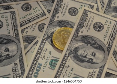 Golden bitcoin coins on a paper dollars - Shutterstock ID 1246534753