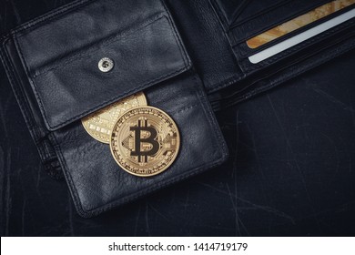 golden bitcoin coins, wallet and money on a black table, dollars, credit card