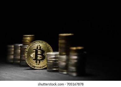 Golden bitcoin on black background. conceptual image for crypto currency.