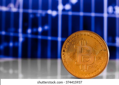 golden bitcoin on blue background