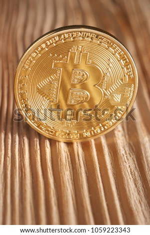 Golden bitcoin on wooden background. Bitcoin crypto currency, Blockchain technology, digital money, Mining concept