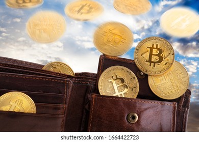 Golden Bitcoins Falling From The Sky And Ending In A Leather Wallet. The Cloudy Weather Is As Volatile As Cryptocurrency