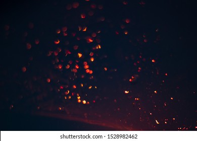 golden bokeh on a black background, garland lights blurred festive  abstract backdrop