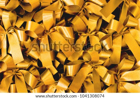 Golden bows pattern background.