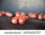 Golden Brats Cooking On The Grill