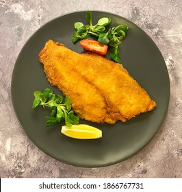 Golden Breaded Fish Plaice Fillet With Lemon.