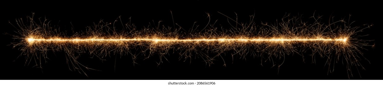 golden bright sparkler wide panorama tracer fuse line isolated on dark black background. anniversary, pyrotechnics, wedding and happy birthday celebration party concept - Shutterstock ID 2086561906