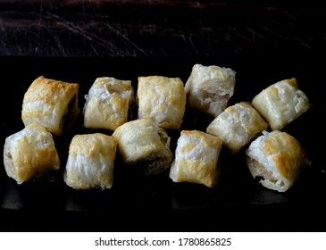 Golden Brown Sausage Rolls On Black With Copy Space Above