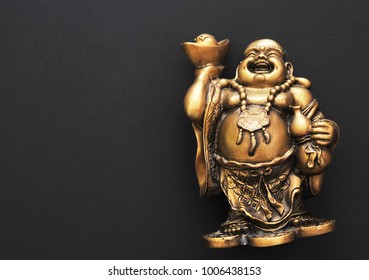 Golden Buddha on a black background 