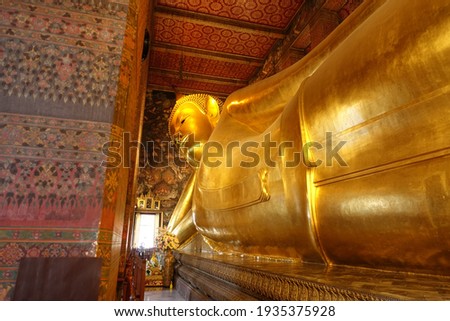 Golden Buddha statue lying in Thailand