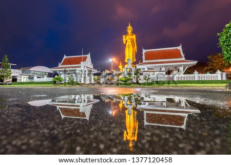 A golden buddha statue on the mountain top at Hat Yai municipality public park, Songkhla Province, Thailand