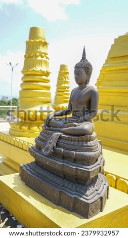  golden buddha statue sitting in srilanka