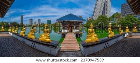 Golden buddha statues at Gangarama Seema Malakaya buddhist temple at Colombo, Sri Lanka.