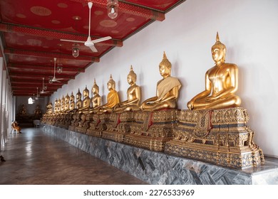 Golden Buddha statues in Wat Pho, Bangkok. Wat Pho is one of the oldest and largest temples in Bangkok features the famous Reclining Buddha