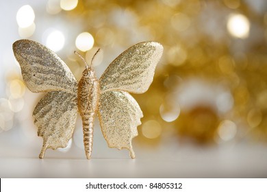 Golden butterfly with soft background