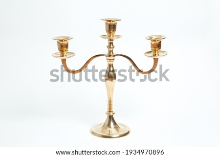 golden candlestick photographed in the studio