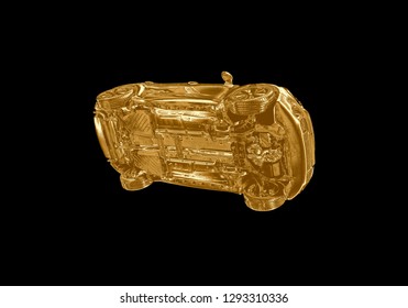 A Golden Car Flying Through The Air In The Pale Black Sky With The Underside Including, Wheels, Engine And Exhaust Pipe Visible...
