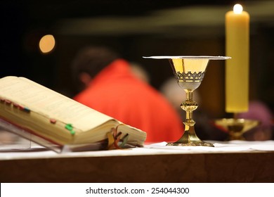 Golden Chalice On The Altar During The Distribution Of Holy Communion