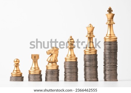 Golden chess include king queen horse ship and pawn on increasing coins stacking and white background , Chess in each position is different value concept.