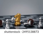 Golden chess knight standing out among toppled silver pieces on a checkered board, symbolizing victory, strategy, and leadership.