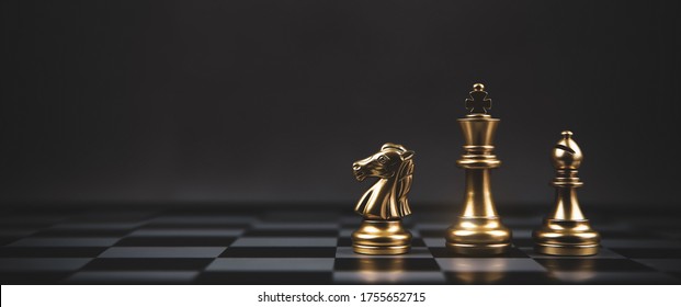 Golden Chess Team On Chess Board Concept Of Business Strategic Plan And Professional Teamwork And Risk Management.