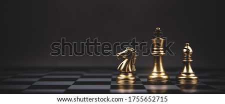 Golden chess team on chess board Concept of business strategic plan and professional teamwork and risk management.