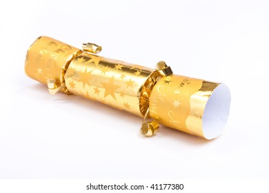 Golden Christmas Cracker Isolated Against White Background.