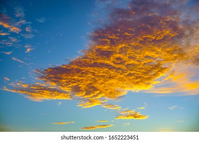 Golden clouds in the sunset time. dramatic and beautiful cloud for background 