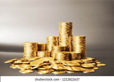 Golden coins stacks on a  background