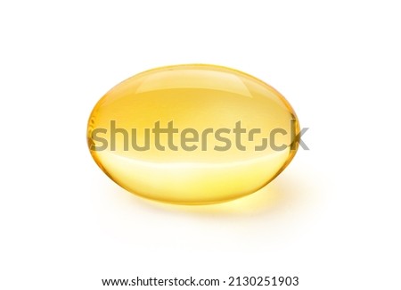 Golden color oil in soft gel capsule isolated on white background. Clipping path