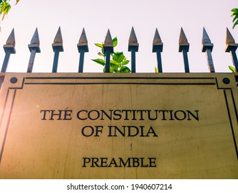 A Golden Color Plate Describing The Constitution Of India. Preamble Declares India To Be A sovereign, Socialist, Secular, And democratic Republic.