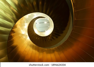 Golden Color Spiral Curve Staircase.Low Angle View. No People. Copy Space