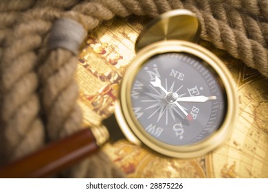 Golden compass and magnifier - Shutterstock ID 28875226