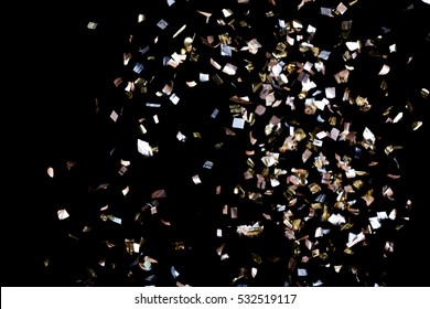 Golden Confetti Isolated On Black Background