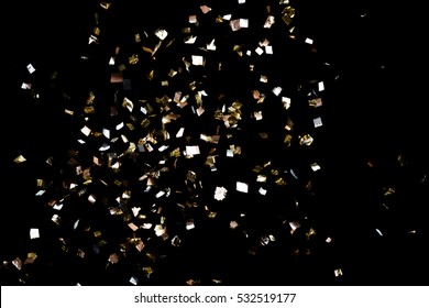Golden Confetti Isolated On Black Background