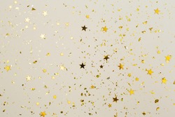 Golden Confetti on Pastel Pink Background, Party Gold Glitter Backdrop.  Stock Photo by JuliaManga