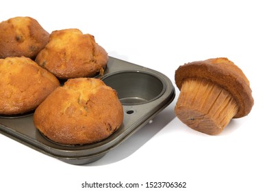 Golden Cranberry Muffins In A Bakery Muffin Pan Isolated On White