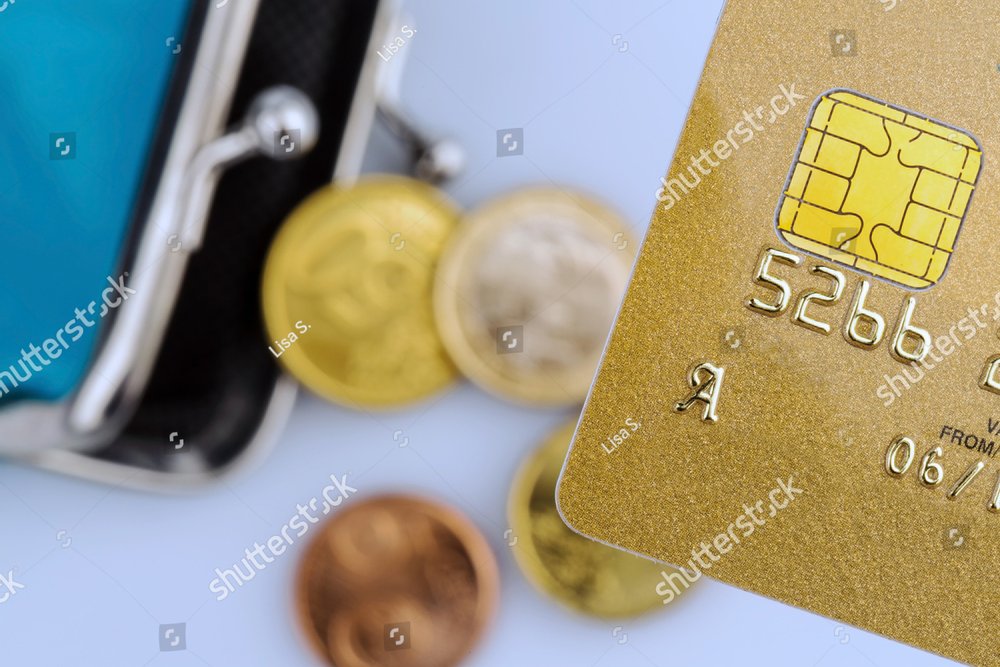 a golden credit card and an empty wallet. symbolic photo for cashless ...