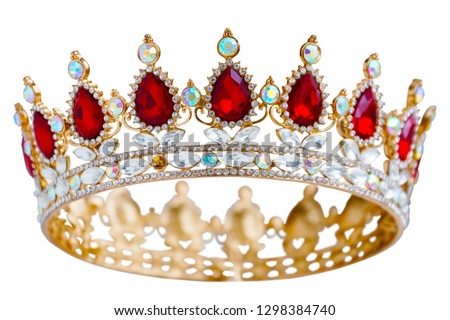 Golden crown with red and white diamonds.  Gold tiara for princess. Expensive jewelry. Decoration for king or queen, magic crown isolated on white background, close up              