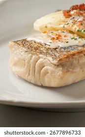 Golden crusted cod in lemony dill cream, a pescatarian delight dancing with zest on International Day of the Seafarer