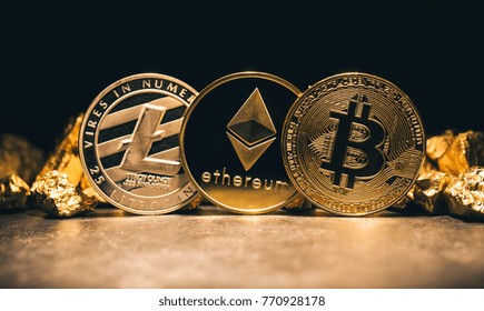 Golden cryptocurrencys Bitcoin, Ethereum, Litecoin and mound of gold - Business concept image - Shutterstock ID 770928178