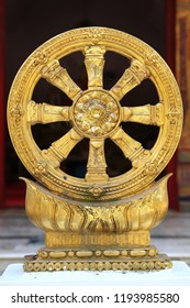 Golden Dharma Wheel On Stand