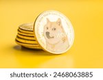 Golden dogecoin coin. Cryptocurrency dogecoin. Doge cryptocurrency on a yellow background.