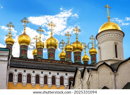 Golden domes of cathedrals in Moscow Kremlin, Russia. This place is famous landmark of Moscow. Scenery of old Russian Orthodox cathedrals and blue sky in Moscow city center in summer. 