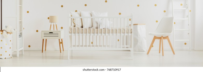 Golden Dot Wall Decals In Minimalist And Cozy Nursery Interior For A Newborn Baby With Simple Bed And White Furniture