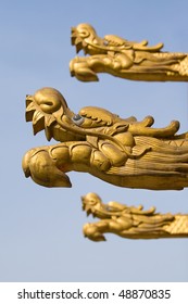 Golden dragon heads in the air