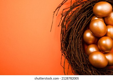 Golden Easter Eggs On Orange Background