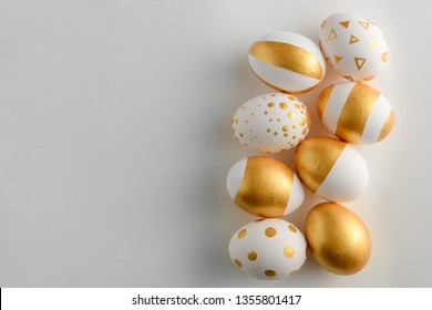 Golden eggs on white background - Powered by Shutterstock