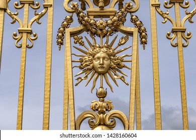 The golden entrance gate of the famous Palace of Versailles. Palace Versailles was a royal chateau. Versailles, Paris, France.
