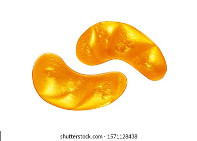 Golden eye patches isolated on white background. Gold collagen eye mask, patch